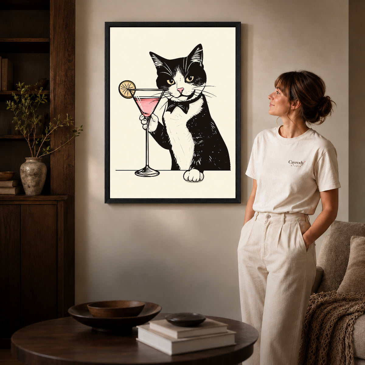 tuxedo cocktail cat canvas art shown in the black frame option against a softly lit wall.