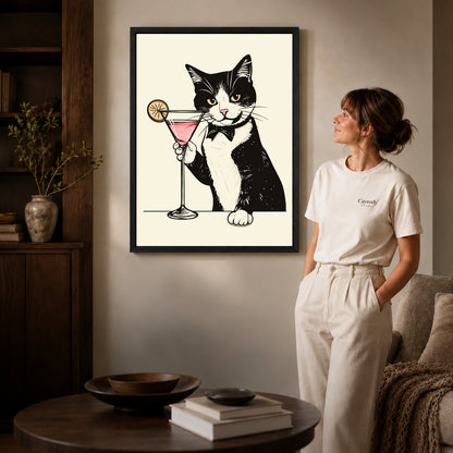 tuxedo cocktail cat canvas art shown in the black frame option against a softly lit wall.