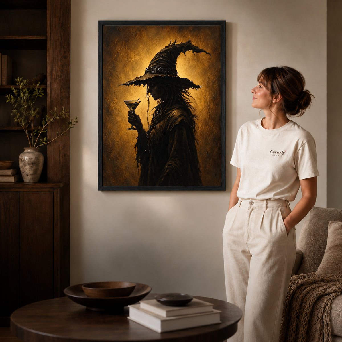 golden twilight witch canvas art shown in the black frame option against a softly lit wall.