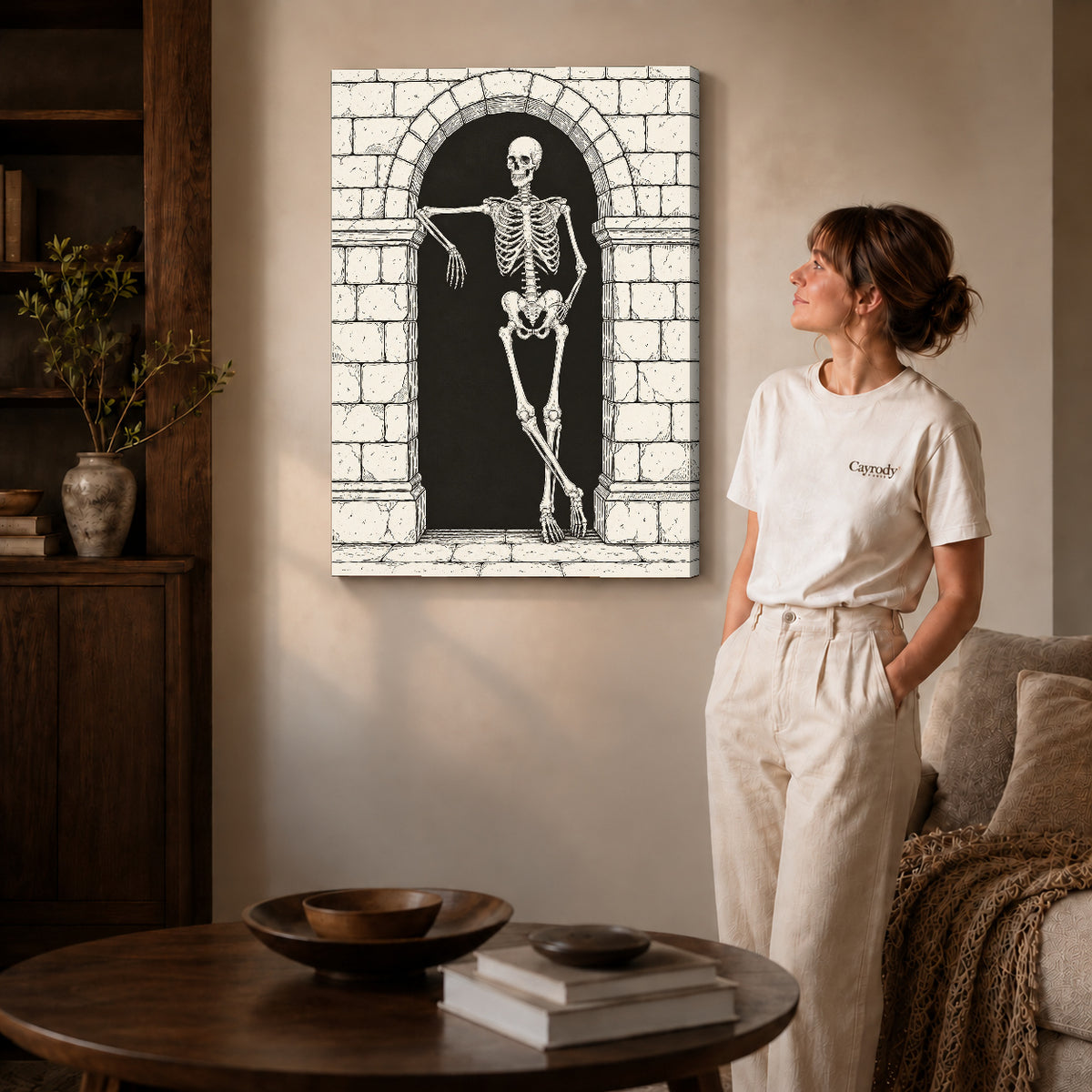 leaning skeleton guest canvas art on gallery-wrapped canvas with natural edge shading beside a standing woman.