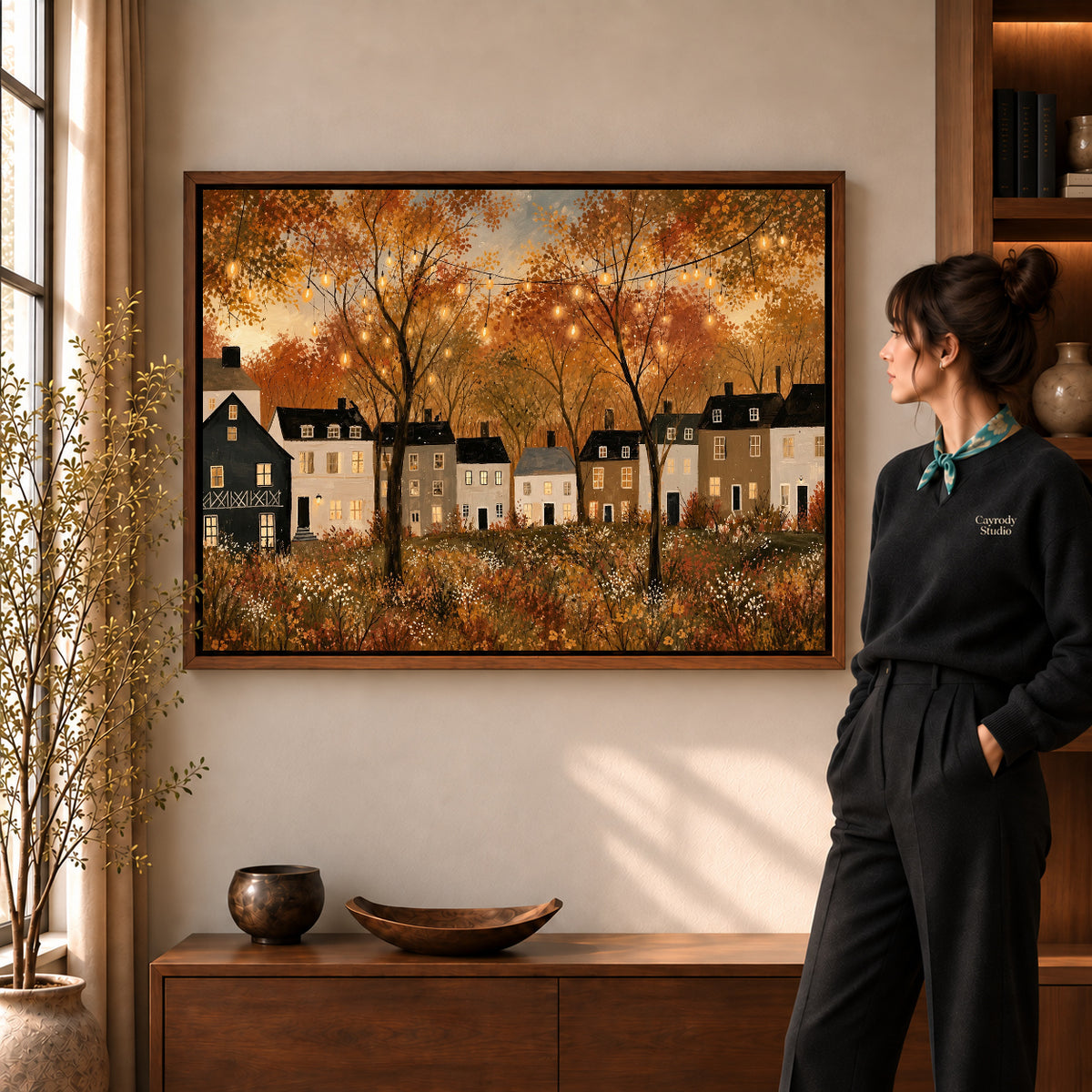 golden village lights canvas art shown in the walnut frame option within a warm living room.