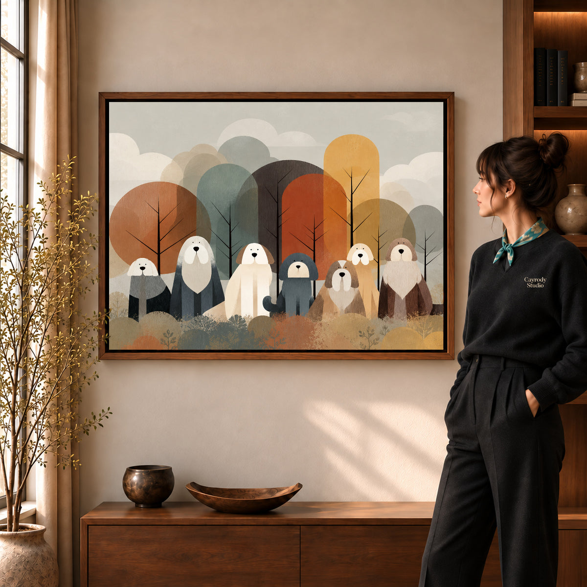 shaggy woodland companions canvas art in a walnut frame beside a standing woman and wooden console.