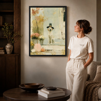 pilgrim porch dog canvas art in a black frame beside a woman and round wooden table.