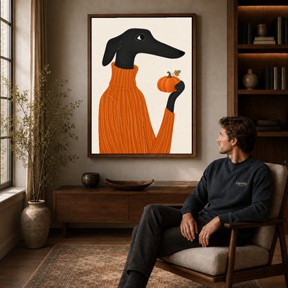 pumpkin sweater dachshund canvas art in a walnut frame above a console beside a seated man.