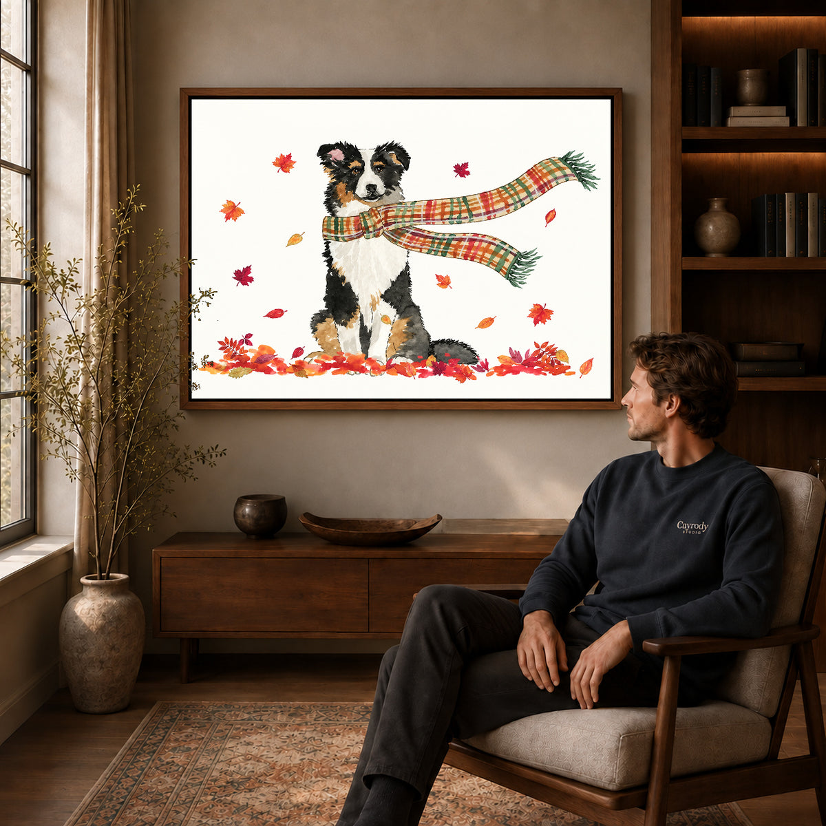 autumn scarf companion canvas art in a walnut frame above a console beside a seated man.