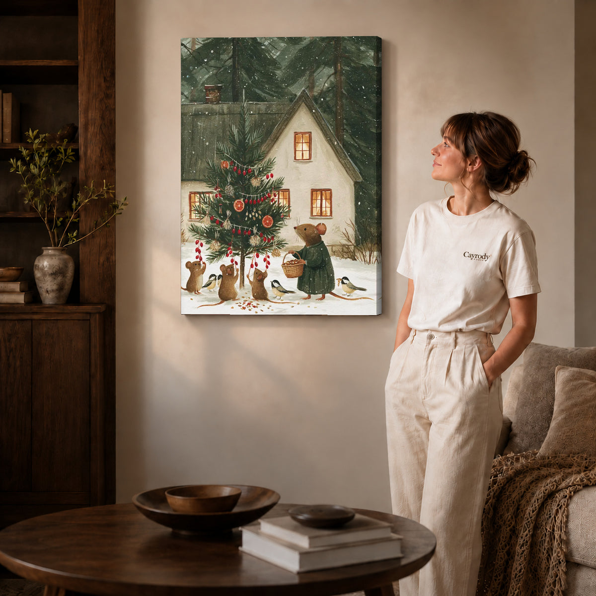 woodland christmas canvas art on gallery-wrapped canvas with natural edge shading beside a standing woman.