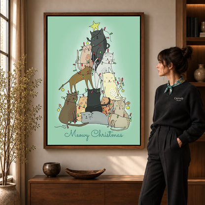 meowy christmas cats canvas art shown in the walnut frame option within a warm living room.