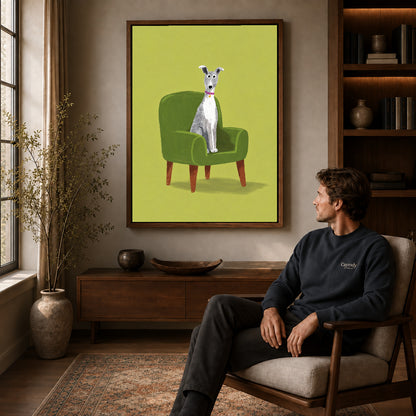 whippet favorite chair canvas art in a walnut frame above a console beside a seated man.