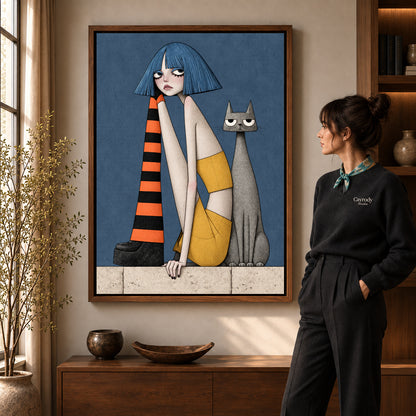 blue bob companions canvas art in a walnut frame beside a standing woman and wooden console.