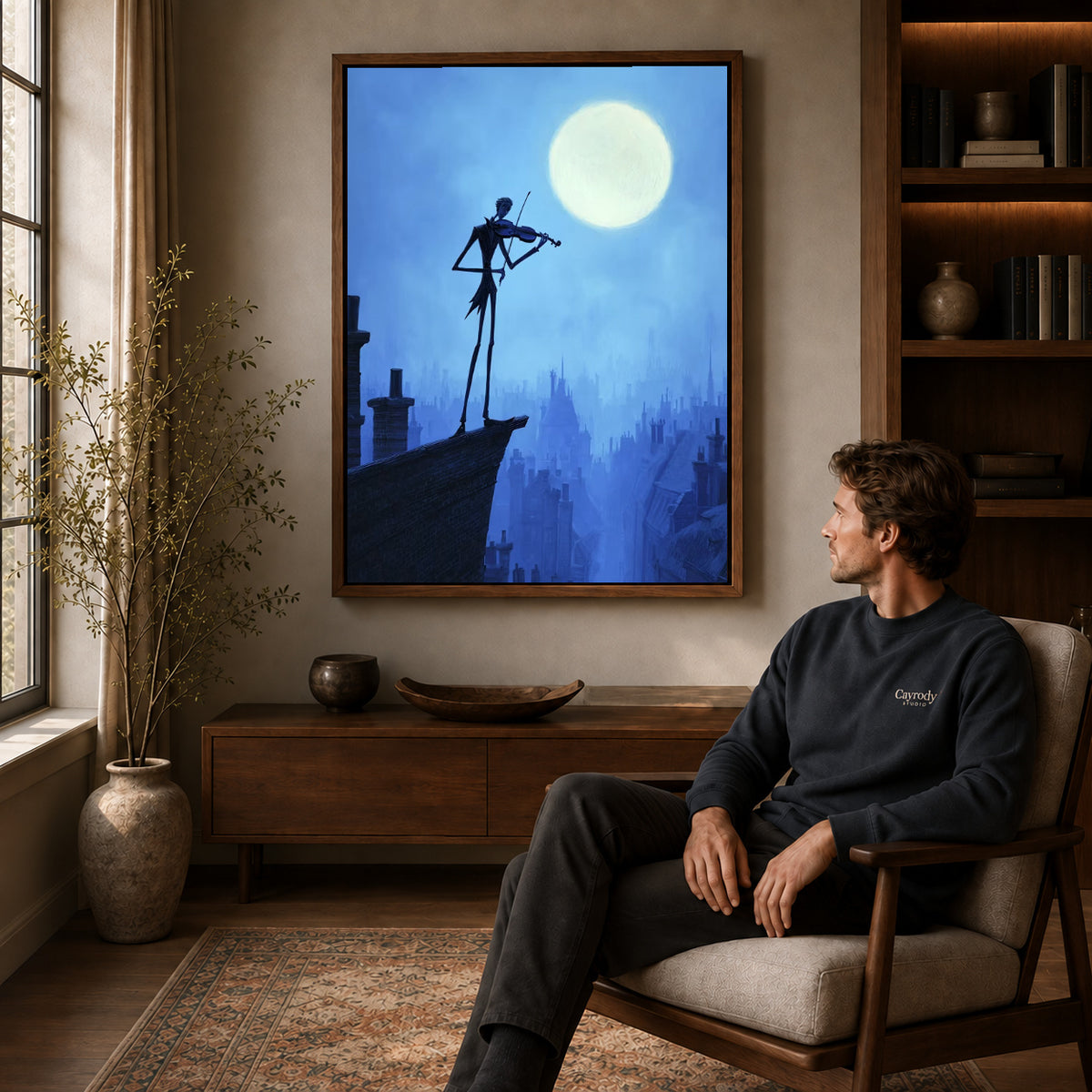 moonlit rooftop violin canvas art in a walnut frame above a console beside a seated man.