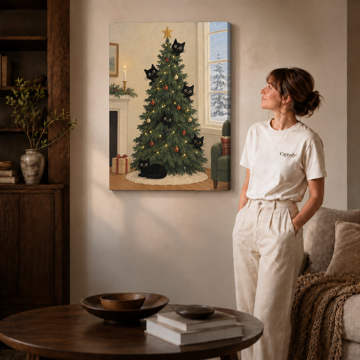 christmas tree cats canvas art on gallery-wrapped canvas with natural edge shading beside a standing woman.