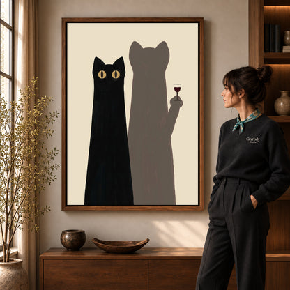 cat shadow toast canvas art in a walnut frame beside a standing woman and wooden console.