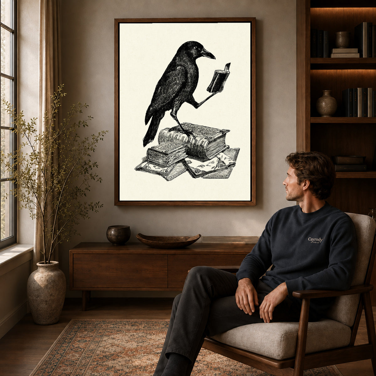 literary crow companion canvas art in a walnut frame above a console beside a seated man.