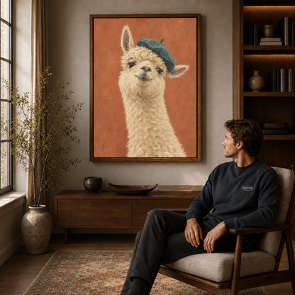 beret llama portrait canvas art in a walnut frame above a console beside a seated man.