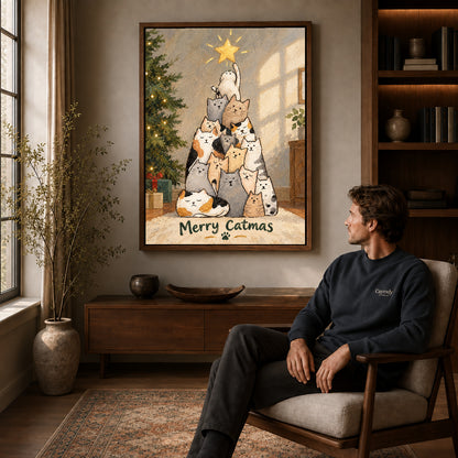 merry catmas gathering canvas art in a walnut frame above a console beside a seated man.