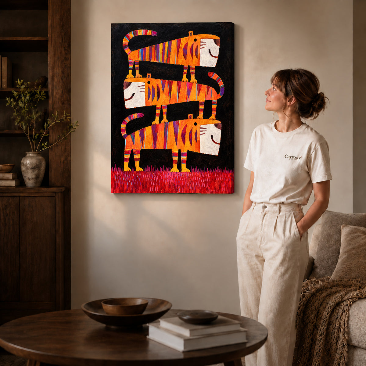striped tiger trio canvas art on gallery-wrapped canvas with natural edge shading beside a standing woman.