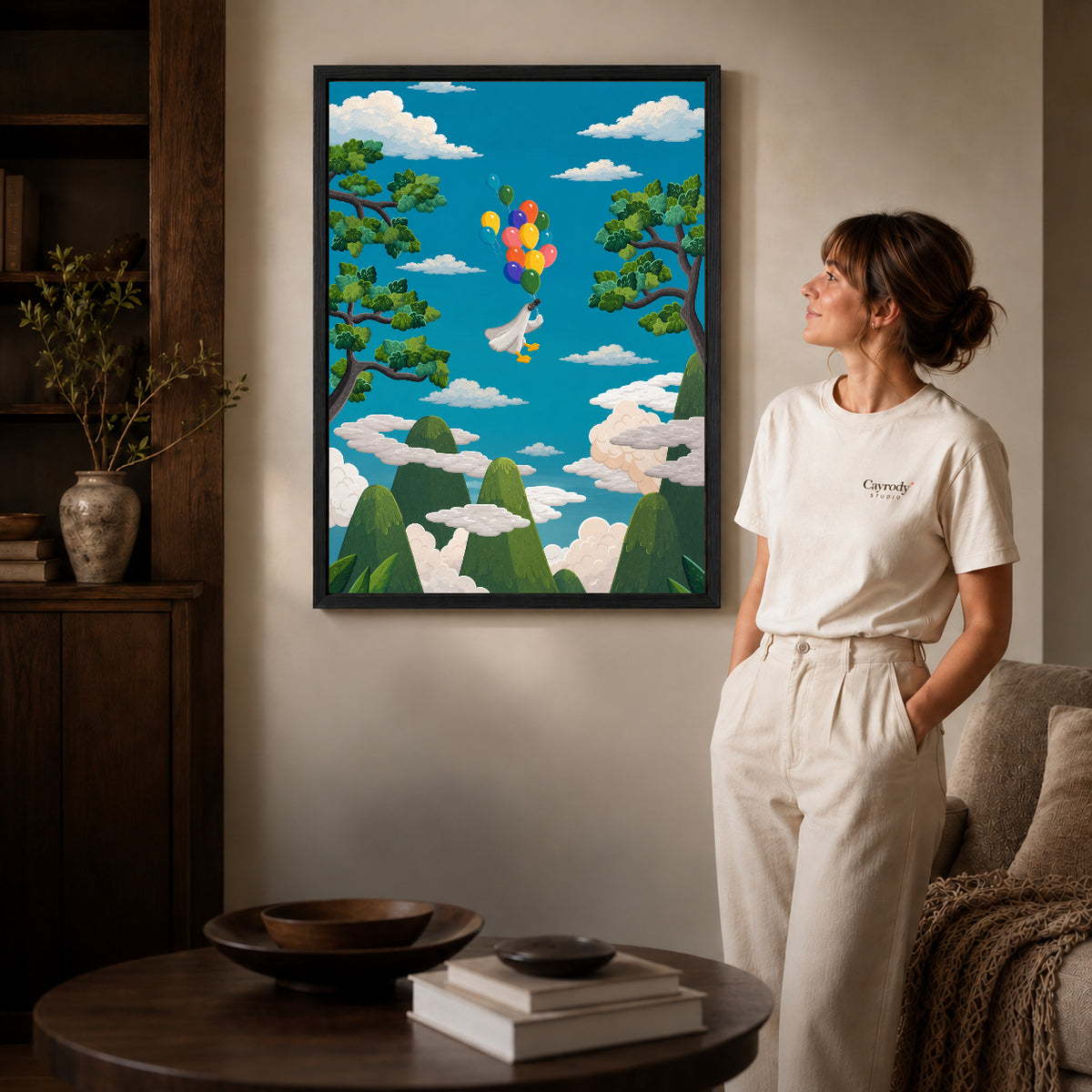 balloon goose journey canvas art shown in the black frame option against a softly lit wall.
