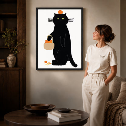 orange basket cat canvas art shown in the black frame option against a softly lit wall.