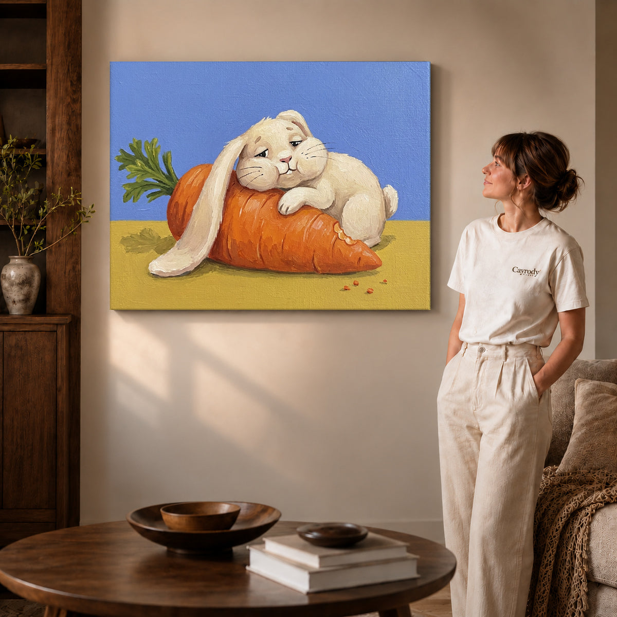 carrot cuddle rabbit canvas art on gallery-wrapped canvas with visible edge depth beside a standing woman.