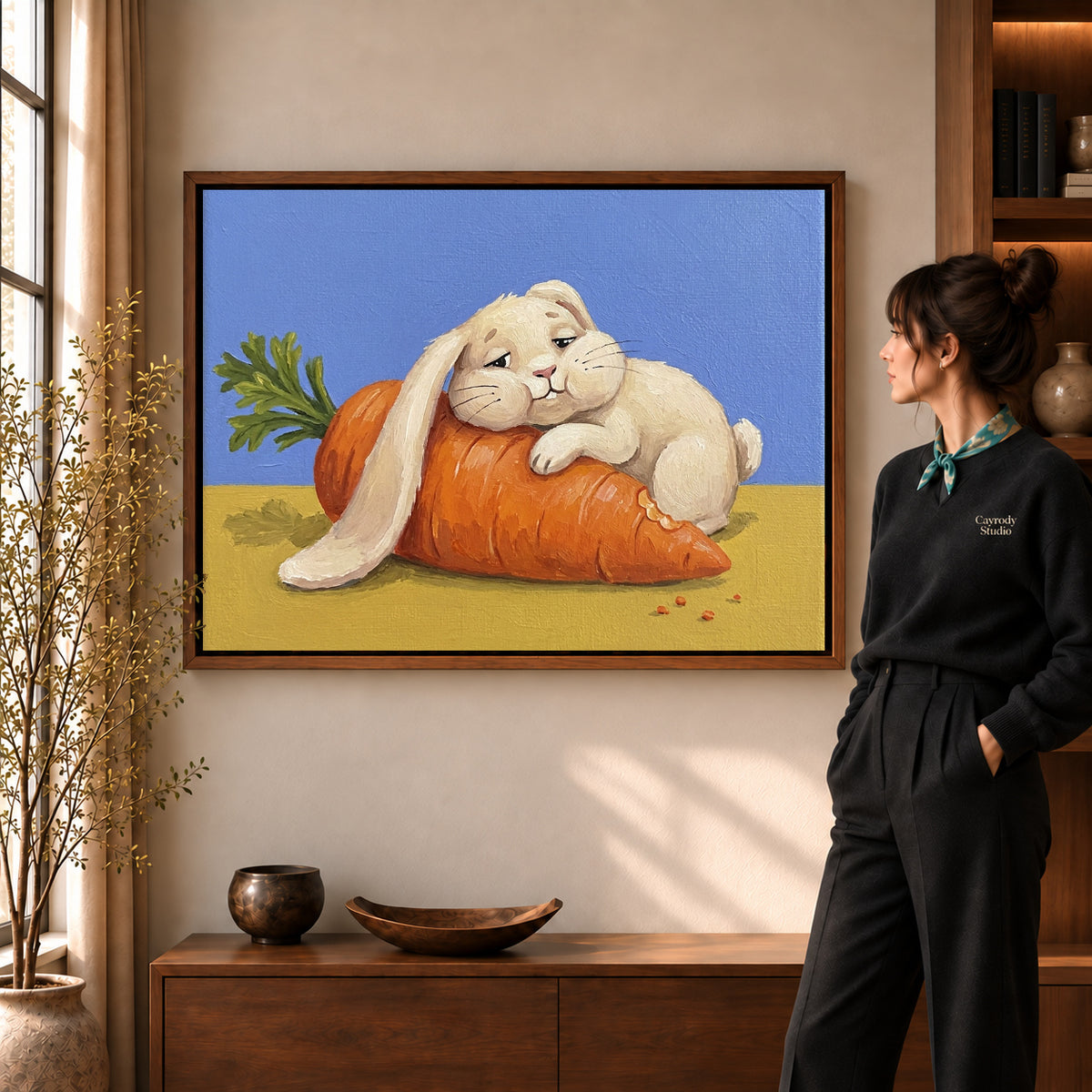 carrot cuddle rabbit canvas art shown in the walnut frame option within a warm living room.