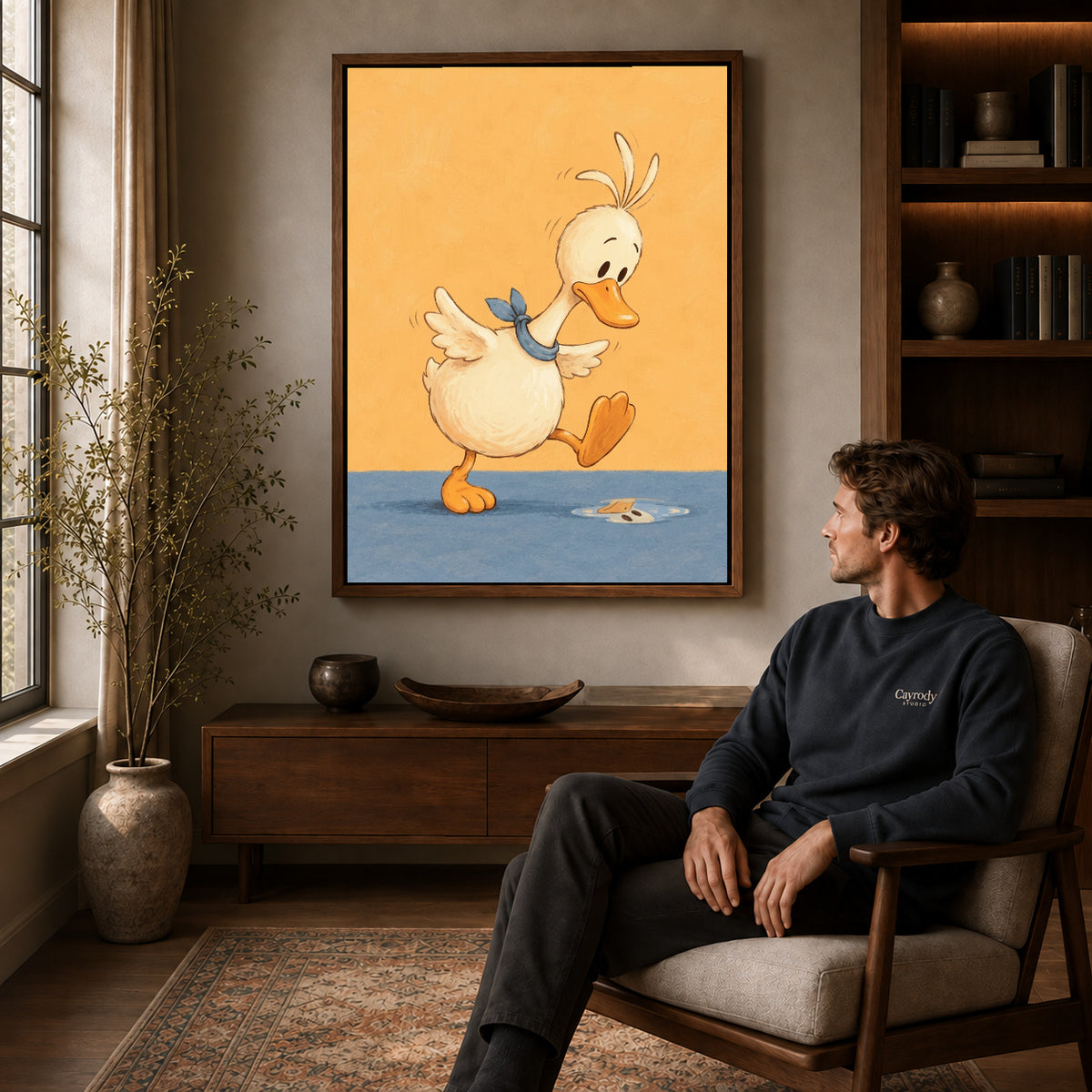 puddle step duck canvas art in a walnut frame above a console beside a seated man.