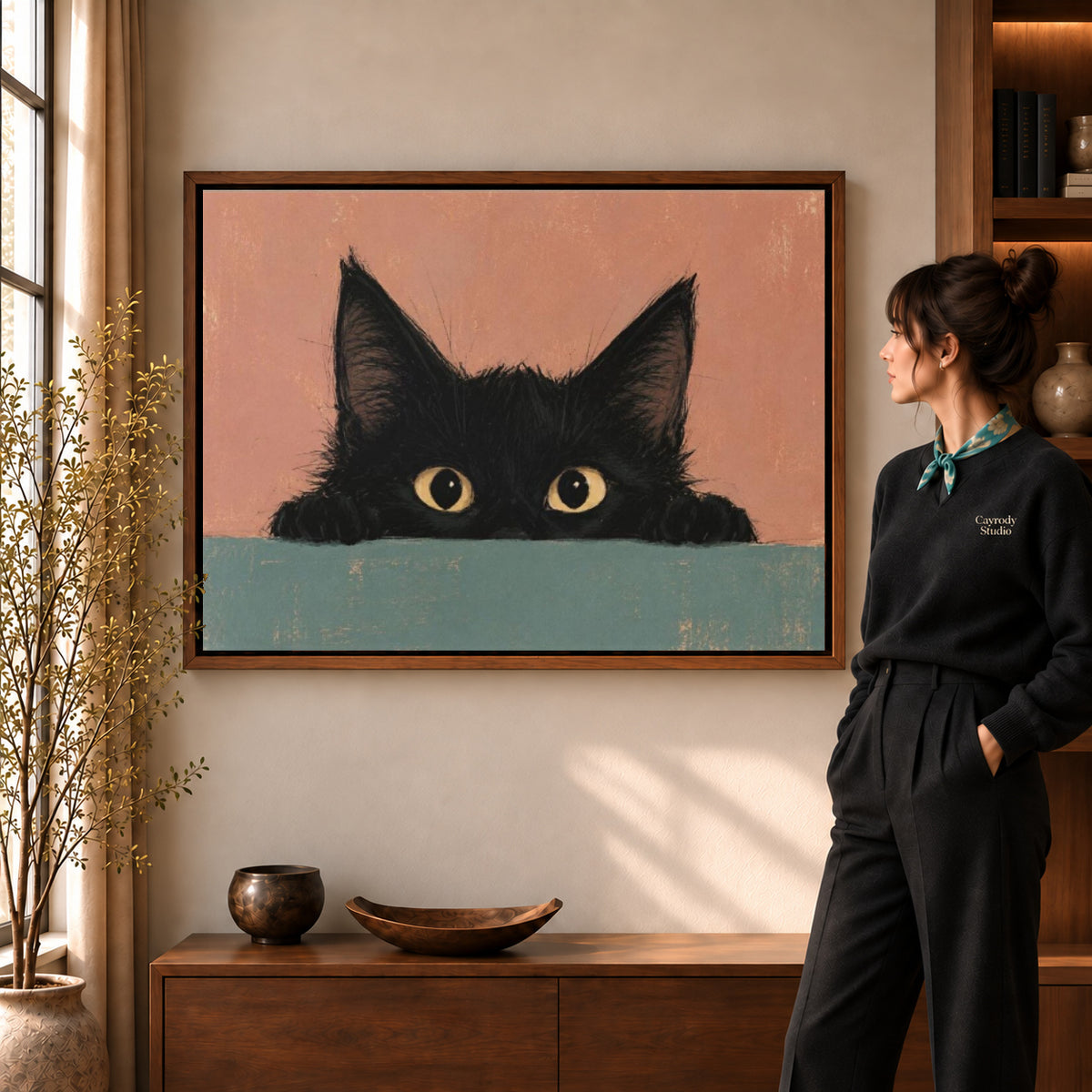 curious peeking kitten canvas art shown in the walnut frame option within a warm living room.