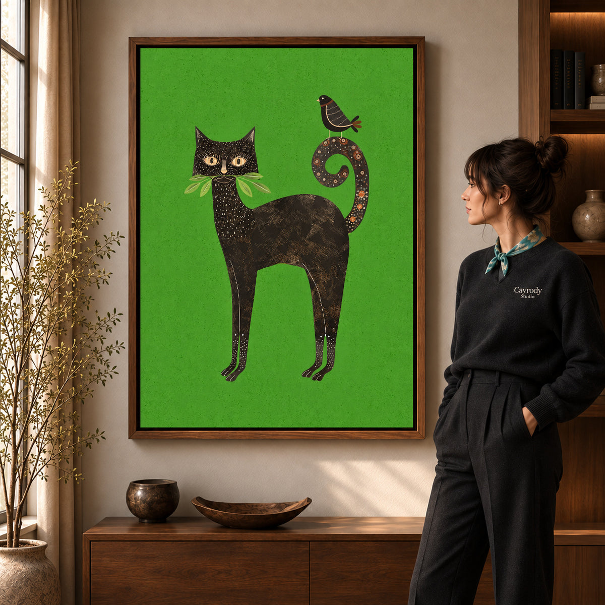 folk garden companions canvas art in a walnut frame beside a standing woman and wooden console.