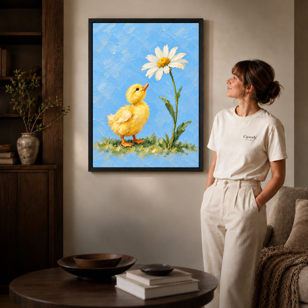 duckling daisy wonder canvas art shown in the black frame option against a softly lit wall.