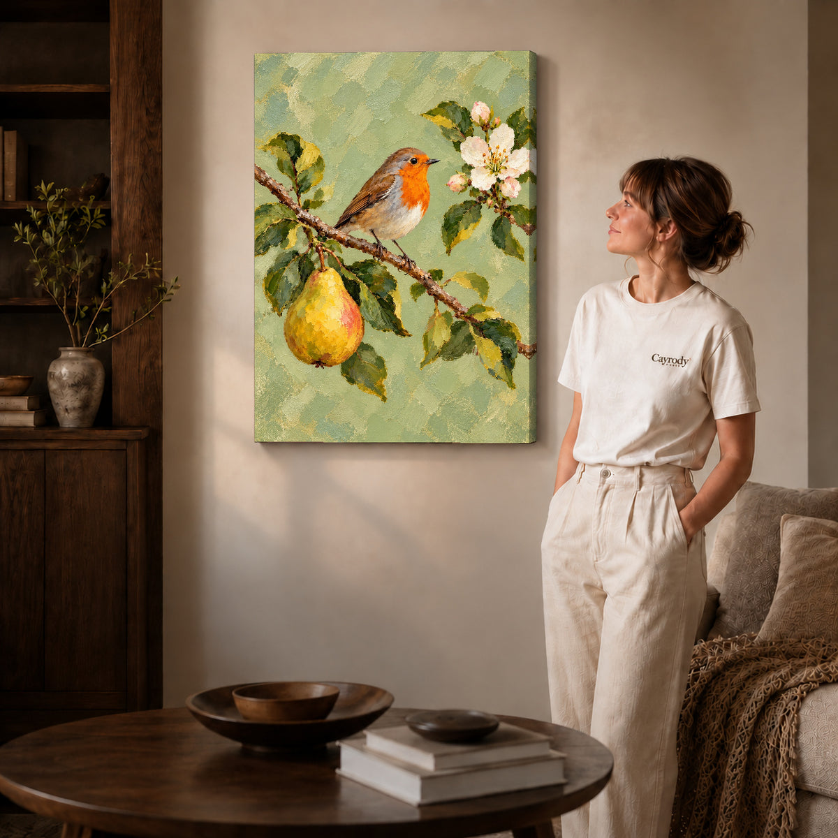 robin pear blossoms canvas art on gallery-wrapped canvas with natural edge shading beside a standing woman.