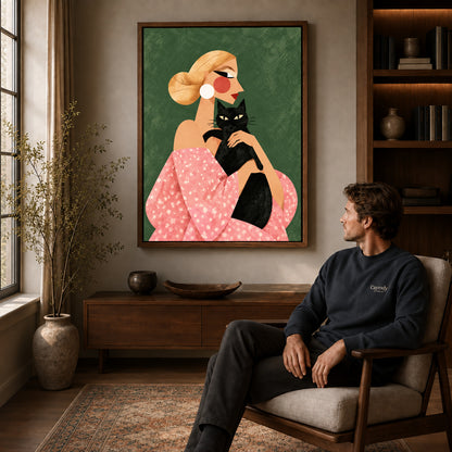 blonde cat companion canvas art in a walnut frame above a console beside a seated man.