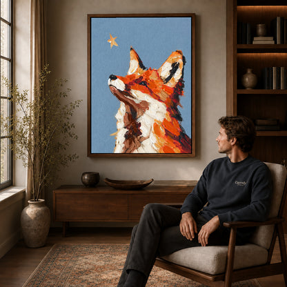 stargazing fox portrait canvas art in a walnut frame above a console beside a seated man.