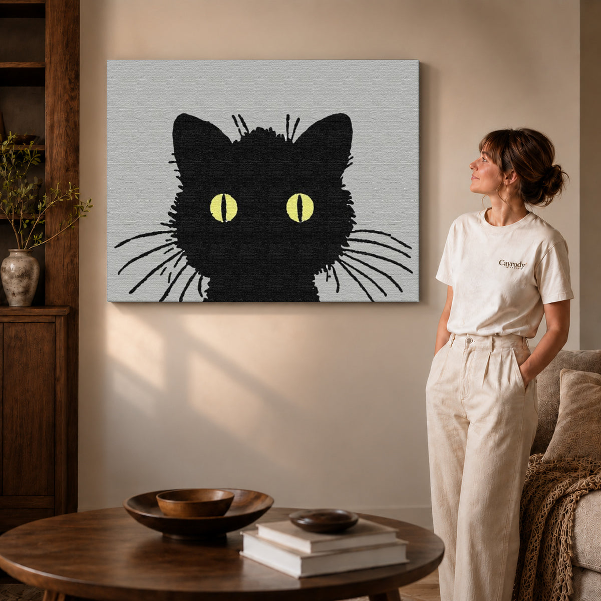 golden eye cat canvas art on gallery-wrapped canvas with visible edge depth beside a standing woman.