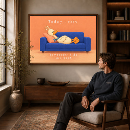 rest day duck canvas art in a walnut frame above a console beside a seated man.