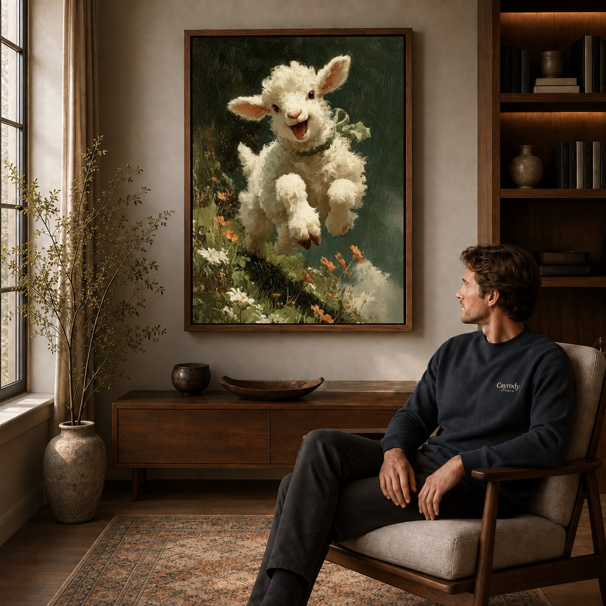 joyful meadow lamb canvas art in a walnut frame above a console beside a seated man.