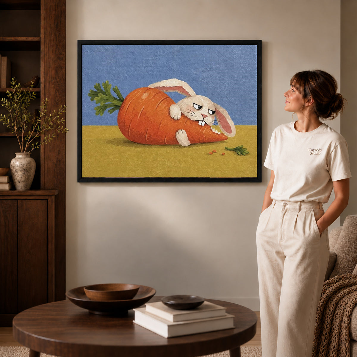 carrot hideaway rabbit canvas art shown in the black frame option against a softly lit wall.