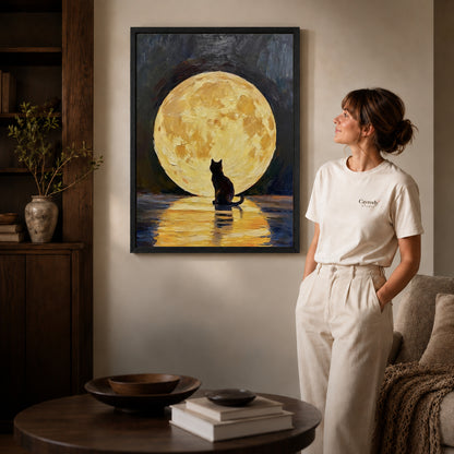 golden moon cat canvas art shown in the black frame option against a softly lit wall.