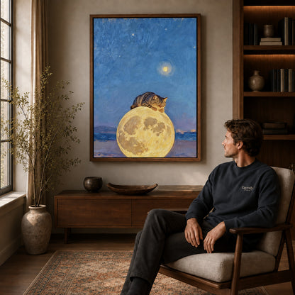 moon pillow cat canvas art in a walnut frame above a console beside a seated man.