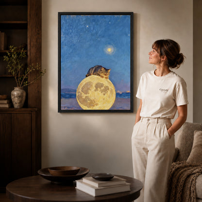 moon pillow cat canvas art shown in the black frame option against a softly lit wall.