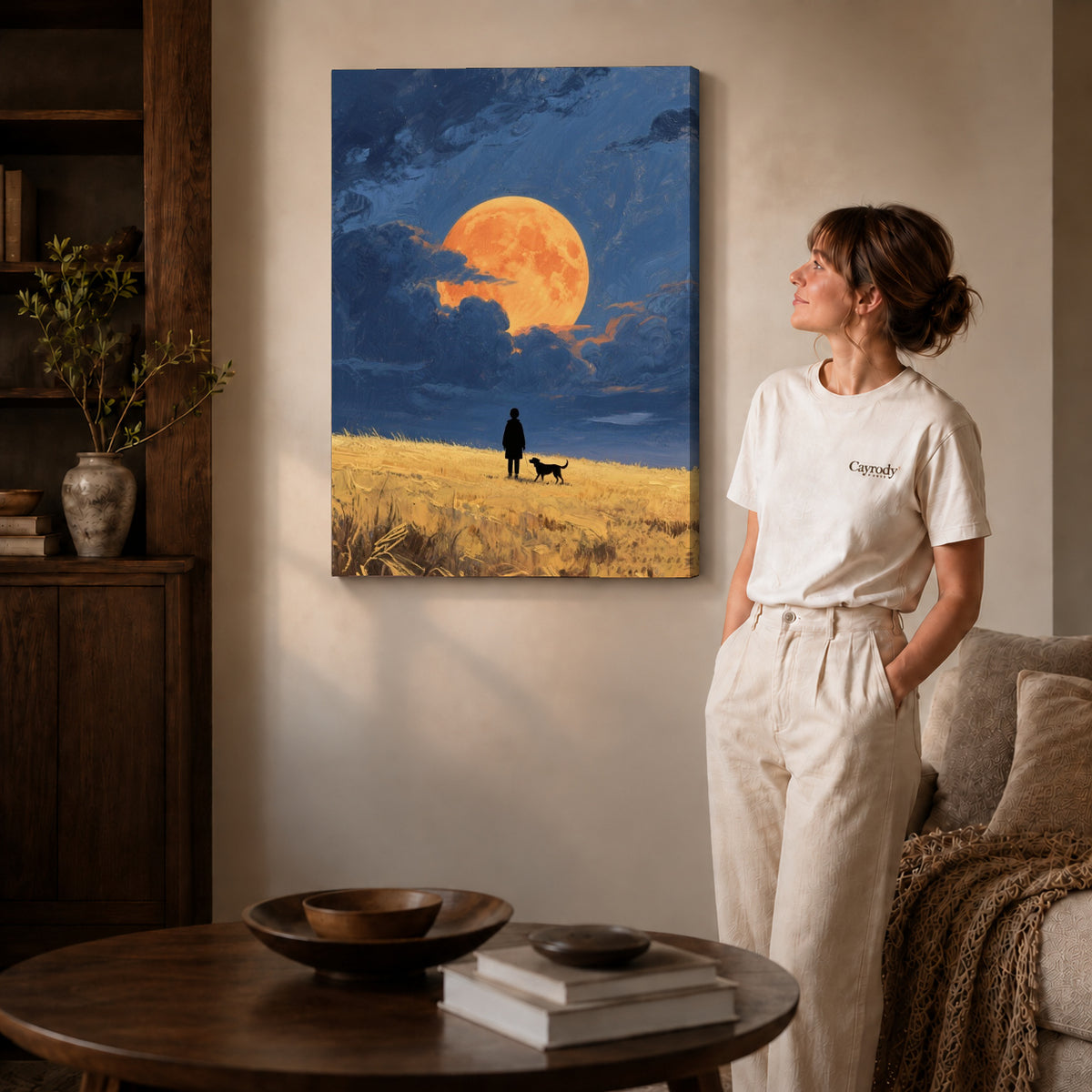 moonlit field companions canvas art on gallery-wrapped canvas with natural edge shading beside a standing woman.