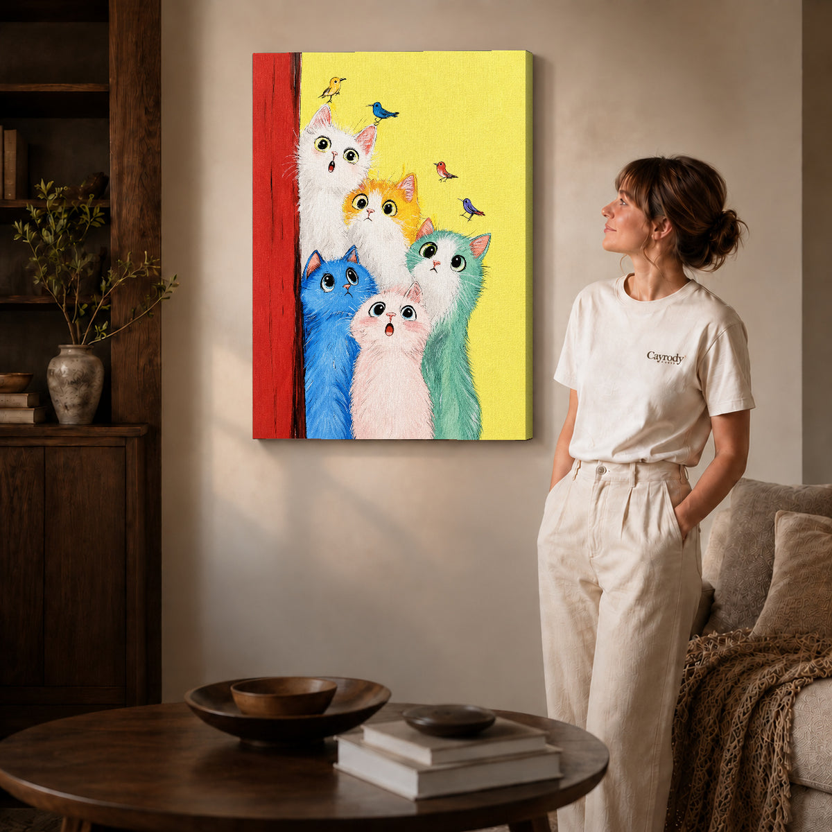 colorful cat chorus canvas art on gallery-wrapped canvas with natural edge shading beside a standing woman.