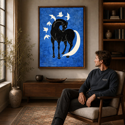 horse bird harmony canvas art in a walnut frame above a console beside a seated man.