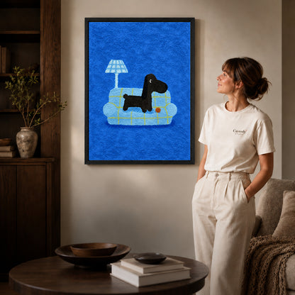 cozy plaid companion canvas art in a black frame beside a woman and round wooden table.