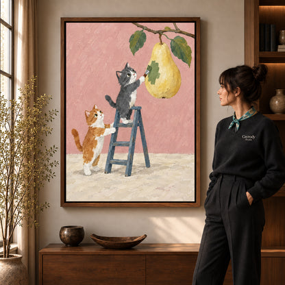 little pear painters canvas art in a walnut frame beside a standing woman and wooden console.