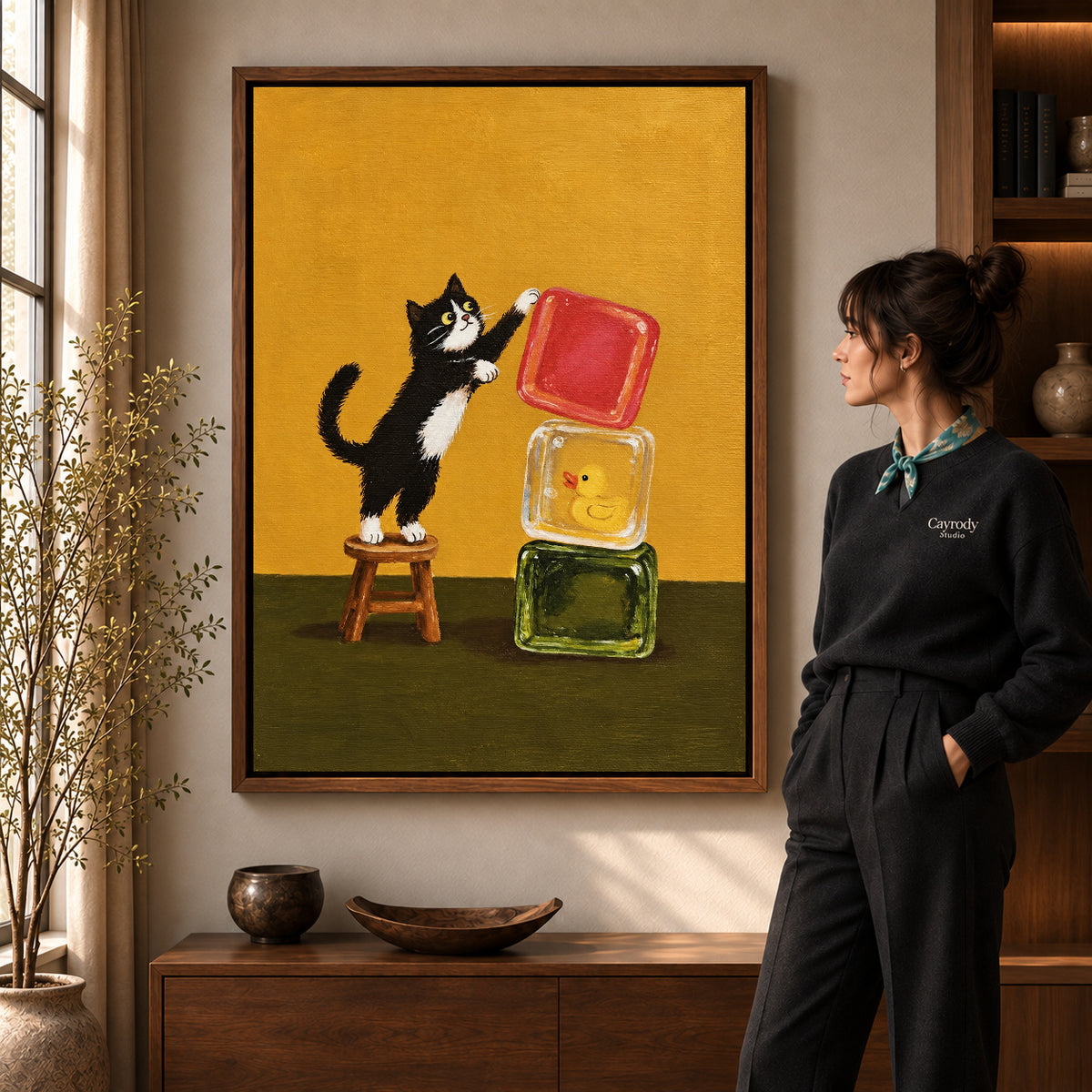 cat block balance canvas art shown in the walnut frame option within a warm living room.