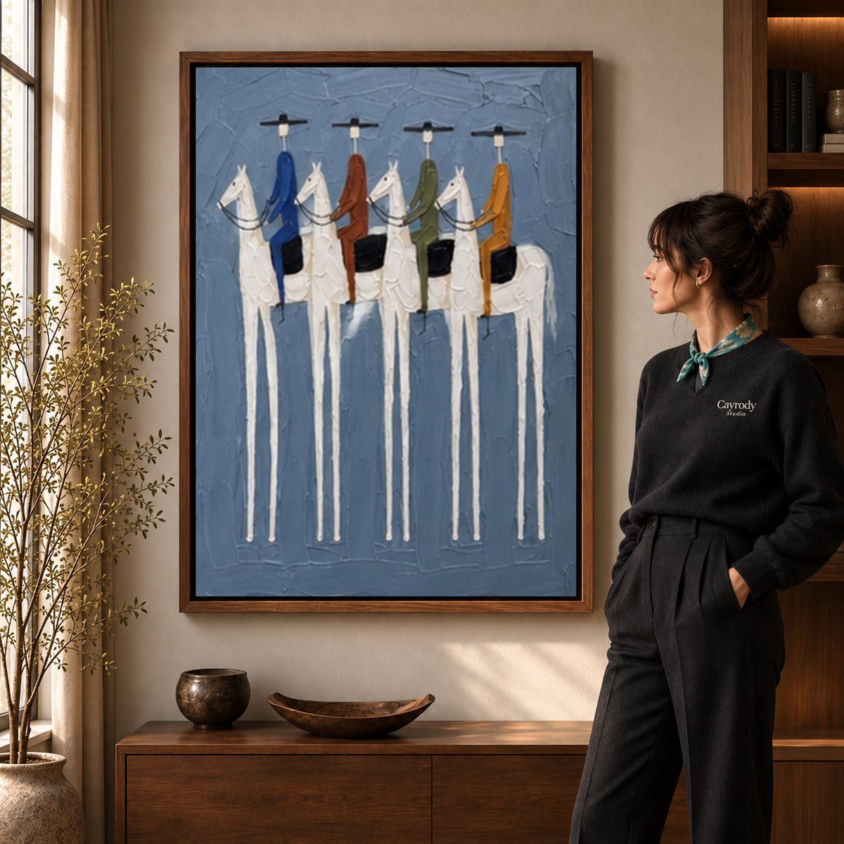 four riders together canvas art shown in the walnut frame option within a warm living room.