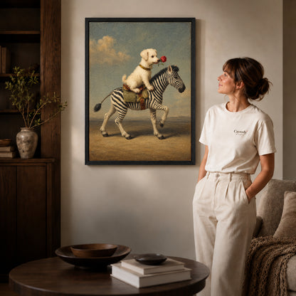 puppy zebra journey canvas art in a black frame beside a woman and round wooden table.