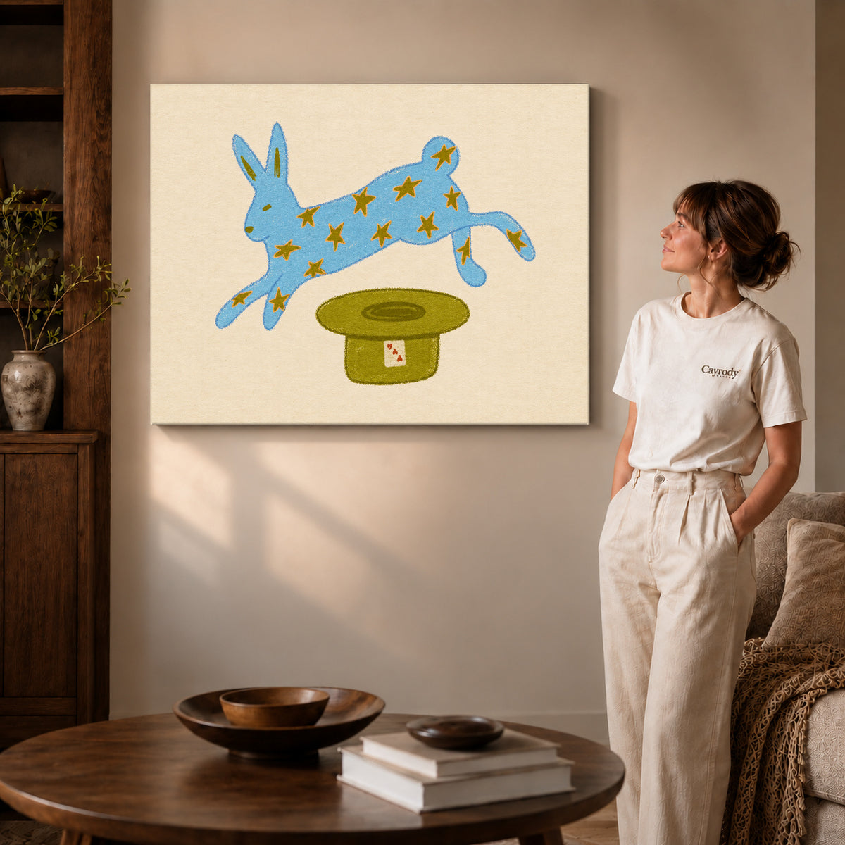star rabbit magic canvas art on gallery-wrapped canvas with visible edge depth beside a standing woman.