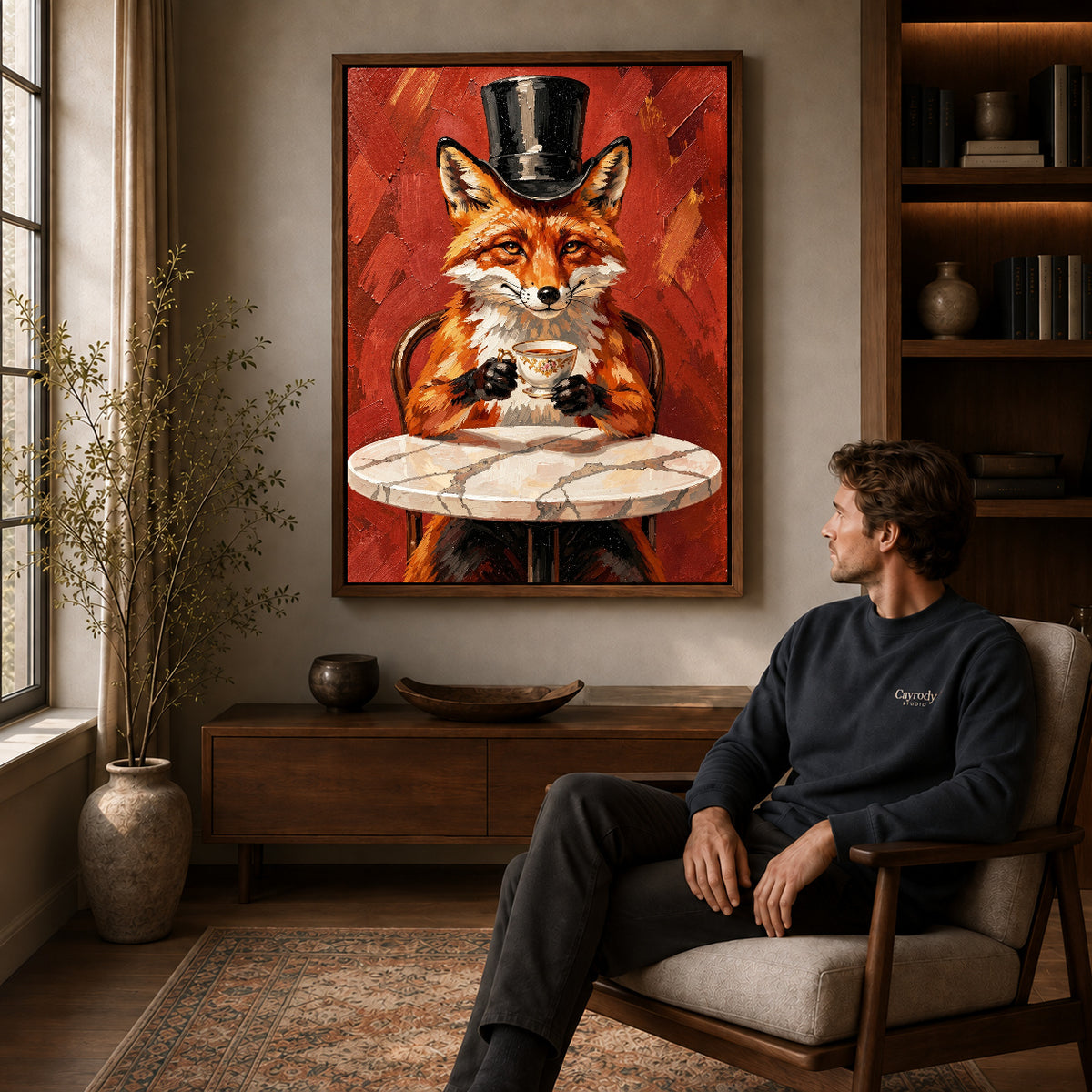 top hat tea fox canvas art in a walnut frame above a console beside a seated man.