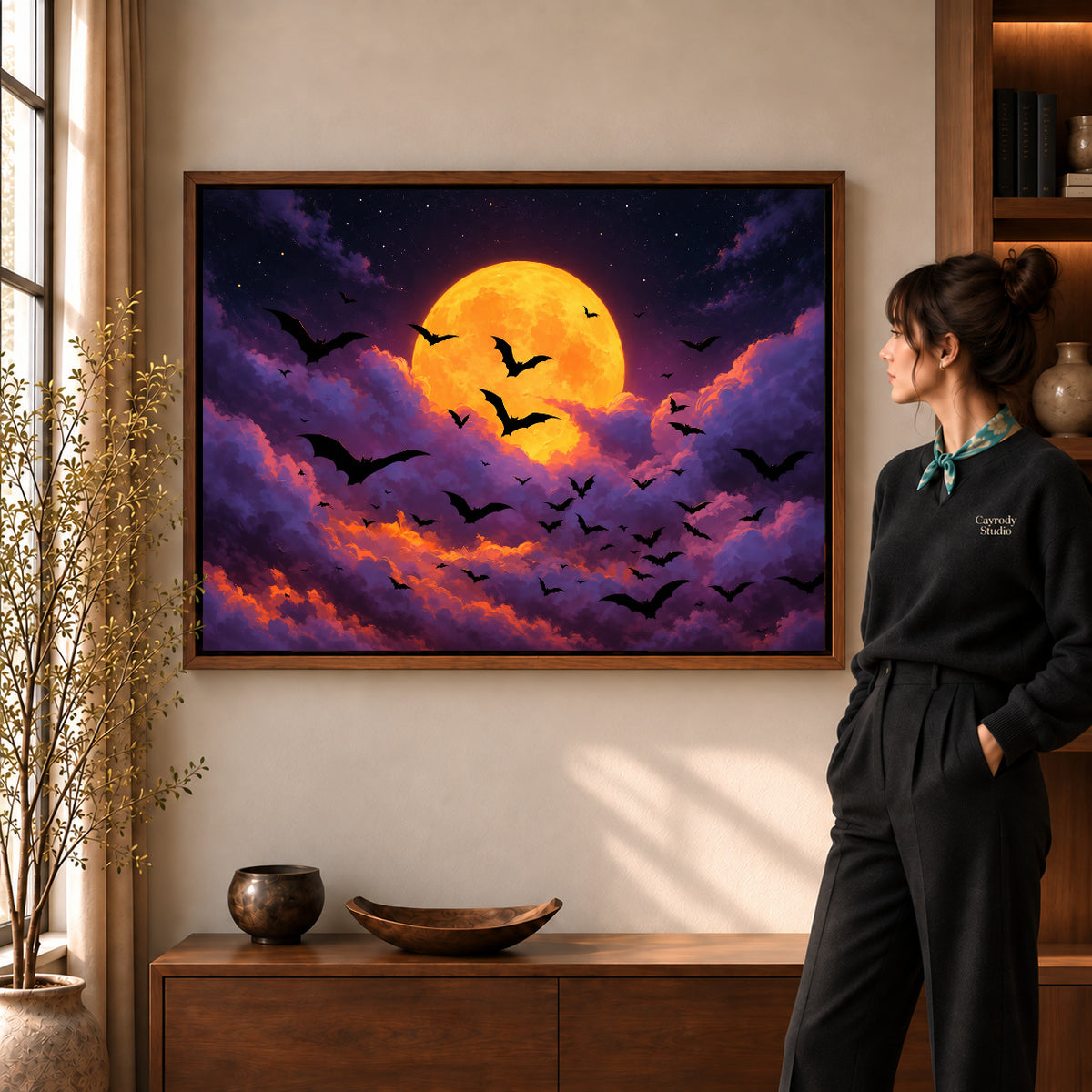 golden moon bats canvas art shown in the walnut frame option within a warm living room.