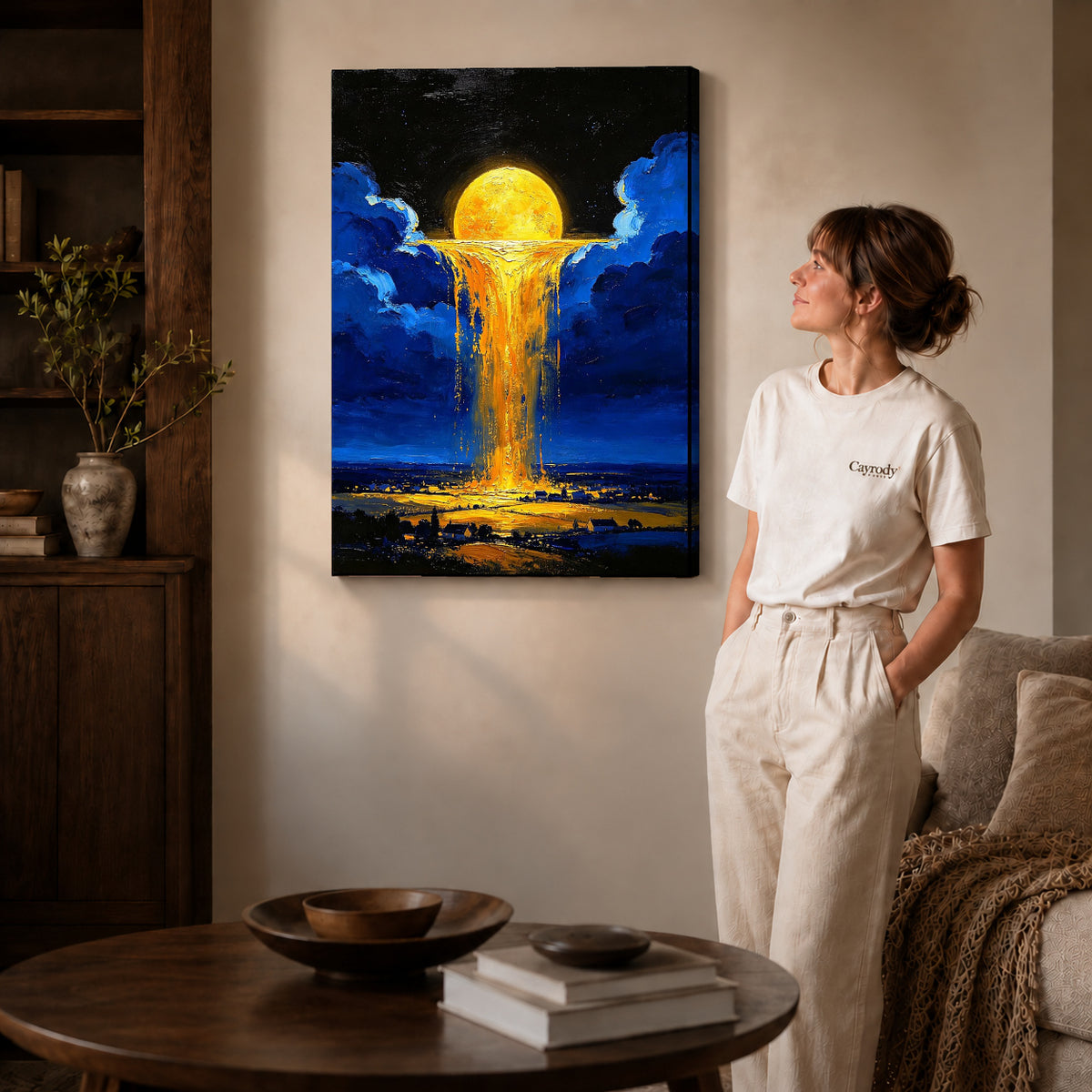 golden sky cascade canvas art on gallery-wrapped canvas with natural edge shading beside a standing woman.